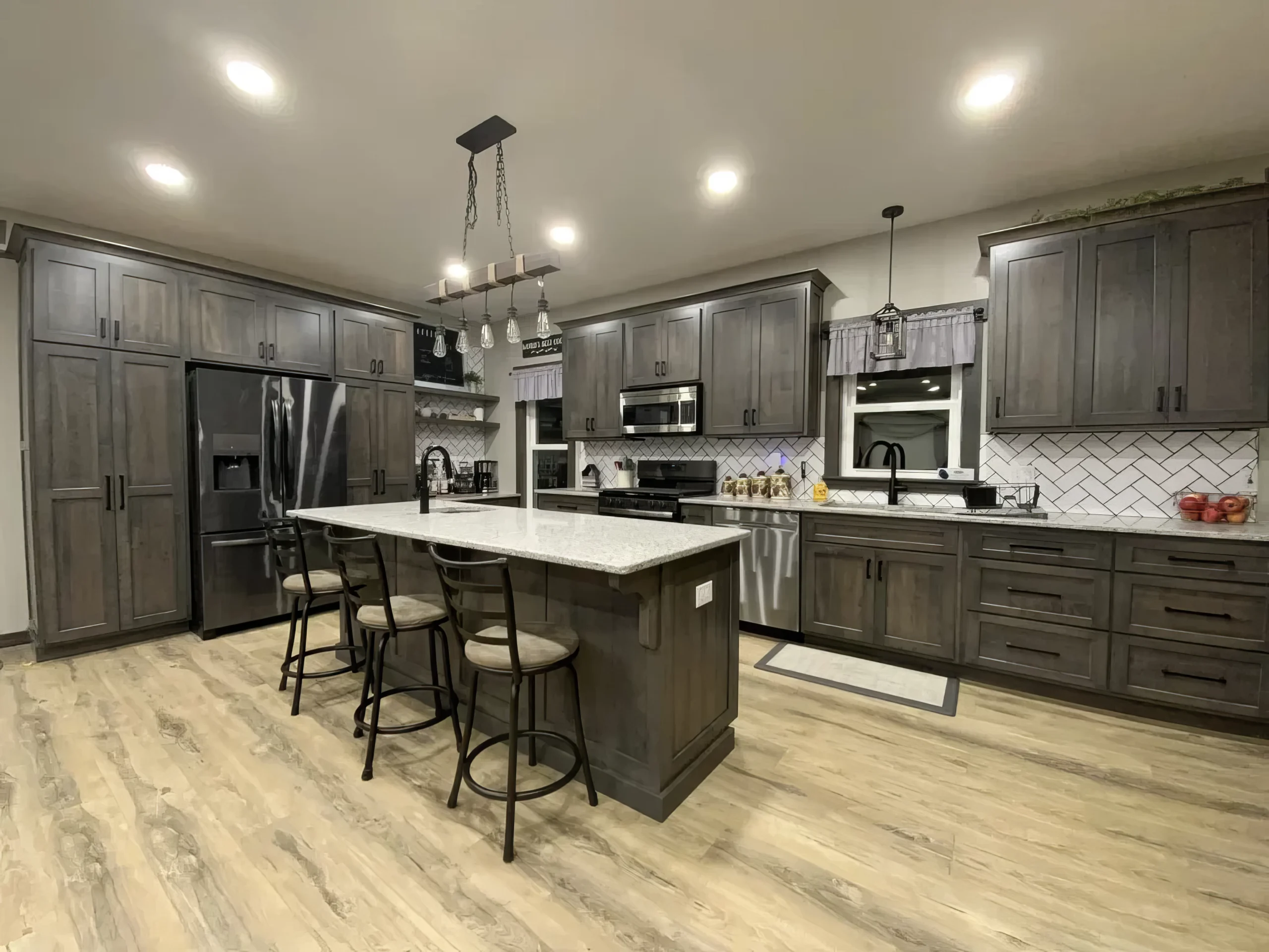 Dark stained cabinets built by Amish installed in a newly remodeled kitchen